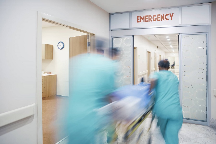 Emergency nurses rushing a patient into the ER Emergency nurses rushing a patient into the ER